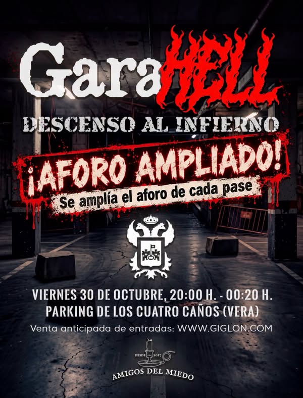 Cartel de un evento de Halloween con el texto GaraHELL, descenso al infierno y aviso de aforo ampliado sobre un aparcamiento.